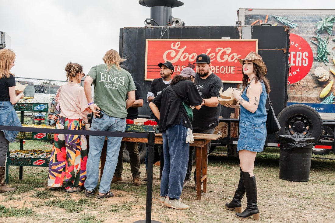 Group of People Getting BBQ from Goode Co. Catering