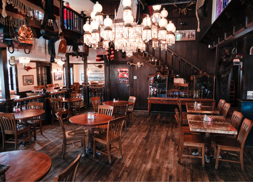 Downstairs Saloon event space with rustic Texas decor at Goode Co. Catering