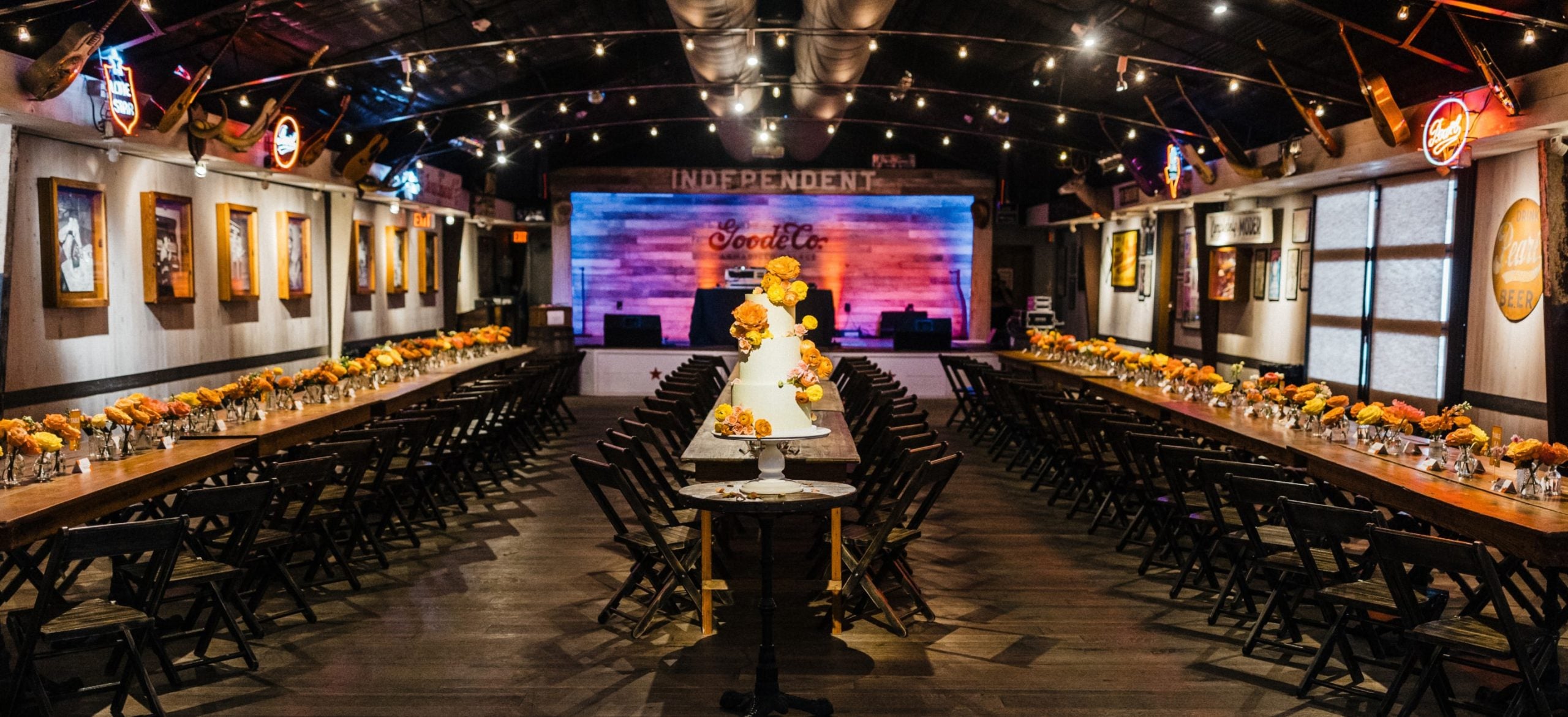 Private dining layout with string lights at Goode Co. Catering event