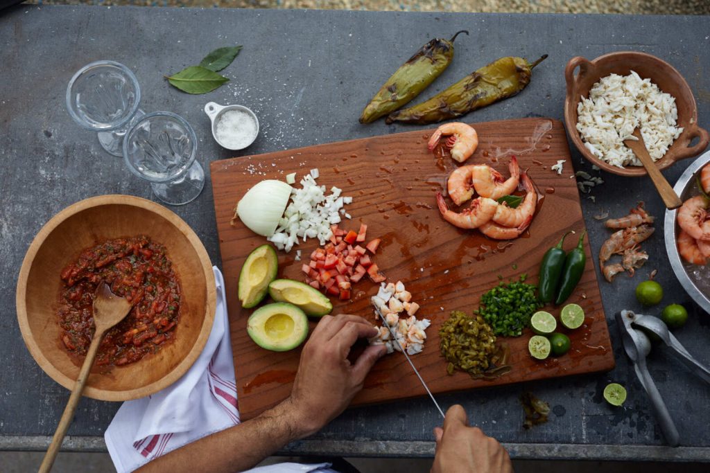 Person Preparing Tex Mex Food on Cutting Board