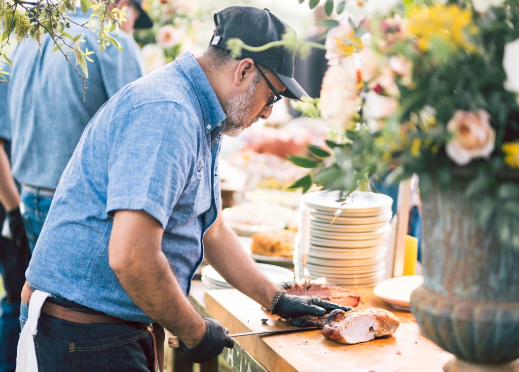 Full-Service Caterer Slicing BBQ meats