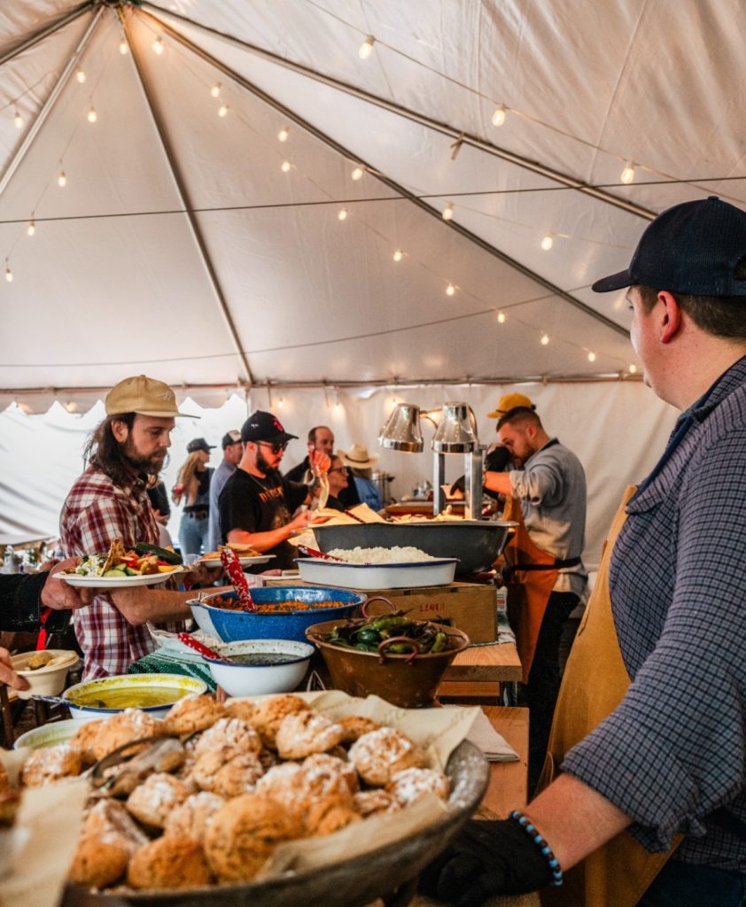 Goode Co Team Serving Food at Catering Event in A Tent