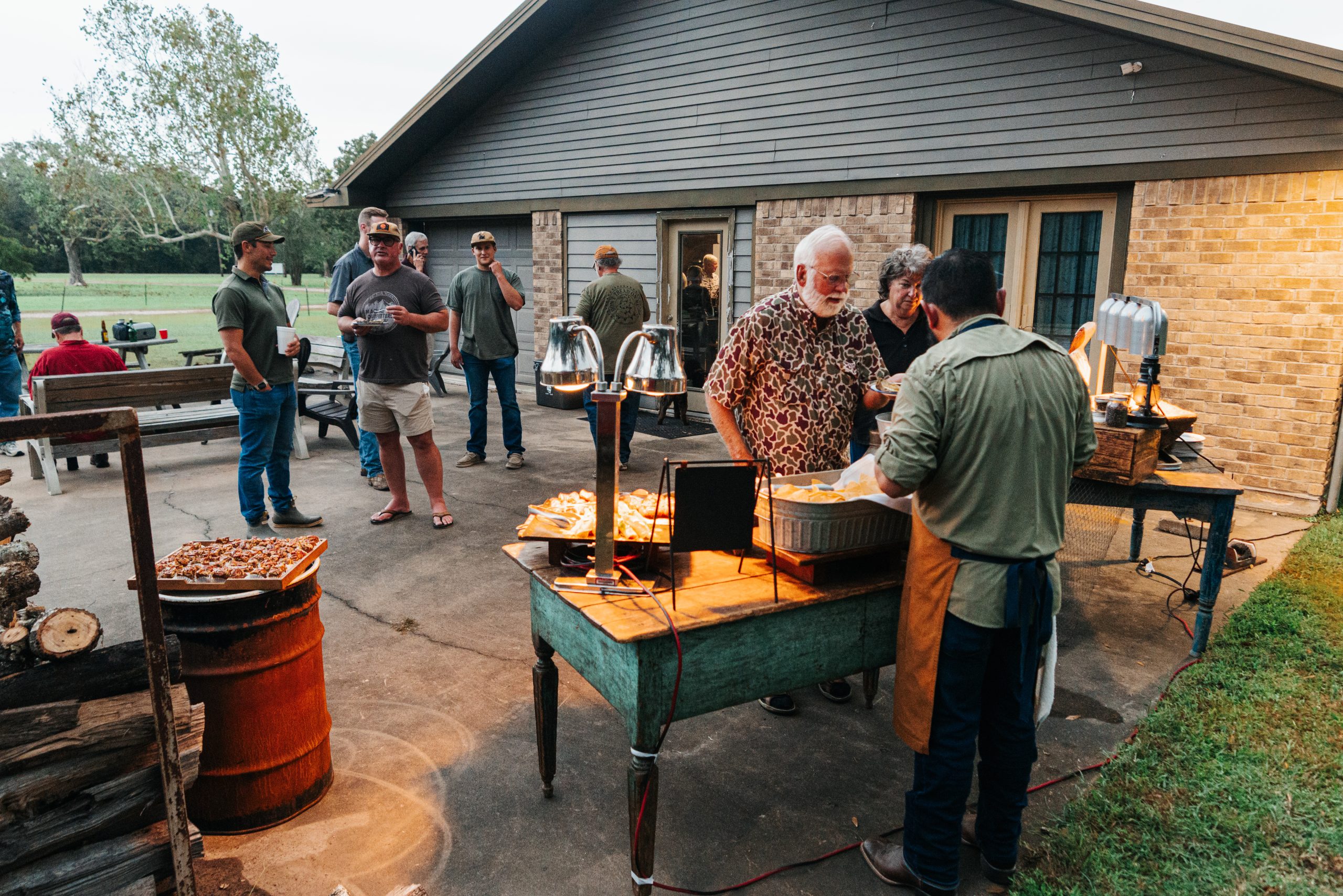 Family Enjoying Goode Co. Catering BBQ Outdoors